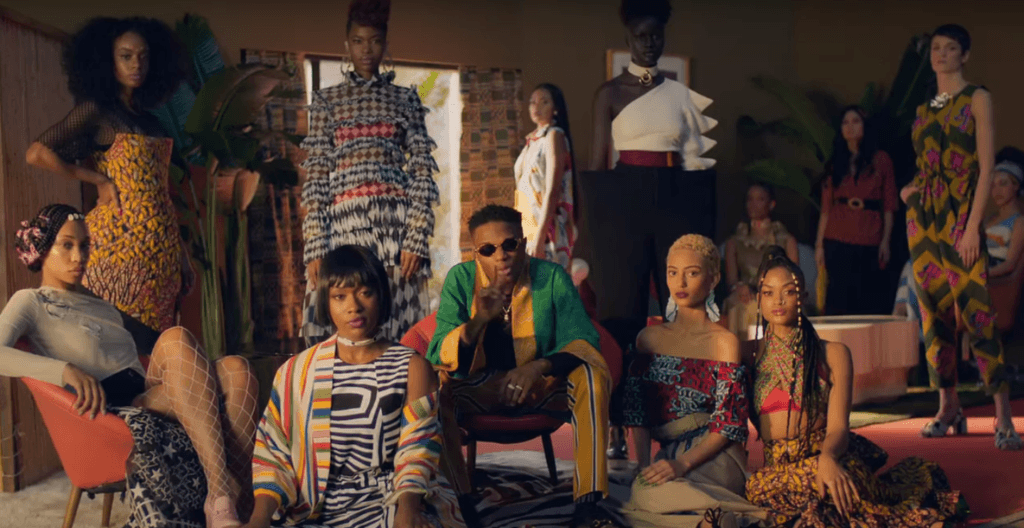 A group of models showcasing vibrant Afrobeats-inspired fashion, featuring bold patterns, Ankara prints, and contemporary designs.