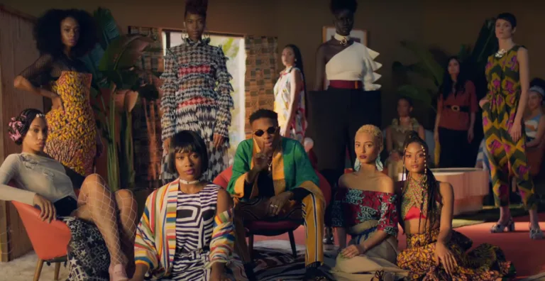 A group of models showcasing vibrant Afrobeats-inspired fashion, featuring bold patterns, Ankara prints, and contemporary designs.